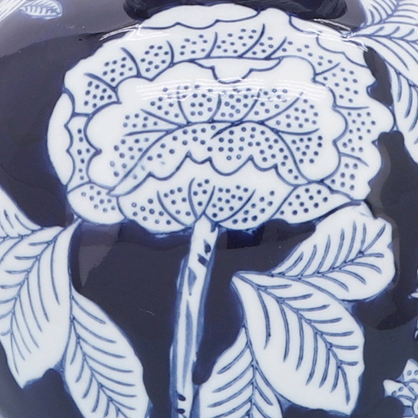 Blue ceramic vase, 9 in., with blue-outlined floral and leaf chinoiserie design.