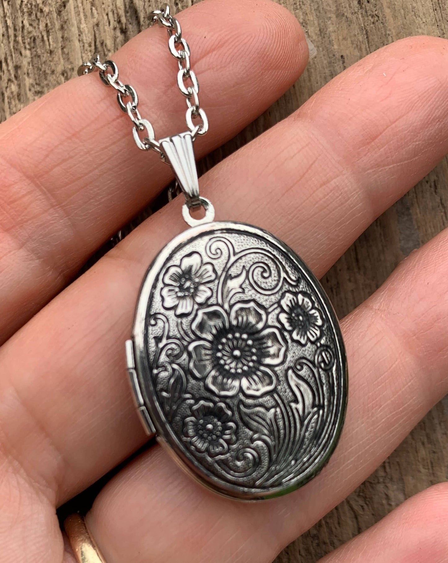 Antiqued silver locket with intricate floral design, moonflower solid perfume inside. Available in 20mm and 30mm sizes.