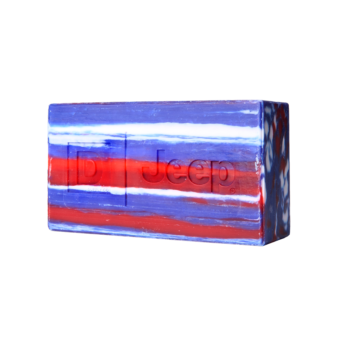 Rectangular soap bar with red, white, and blue stripes and embossed Jeep grille. Available in multiple sizes.