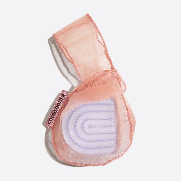 Terracotta RPET Beauty Bar Conditioner in light pink mesh bag with pink tag. Available sizes: standard, travel.