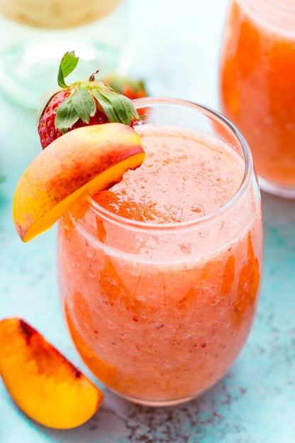 Peach and strawberry smoothie made with Wine & Cocktail Slush Mix Bags, available in small, medium, and large sizes.