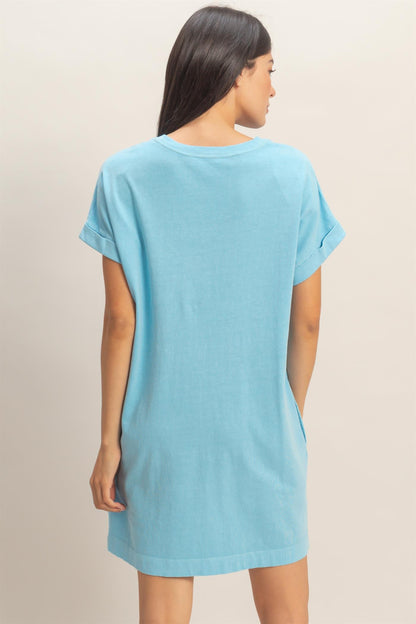 Relaxed Fit Crewneck T-Shirt Dress in light blue cotton, loose fit, short sleeves with rolled cuffs. Available in XS–XXL.