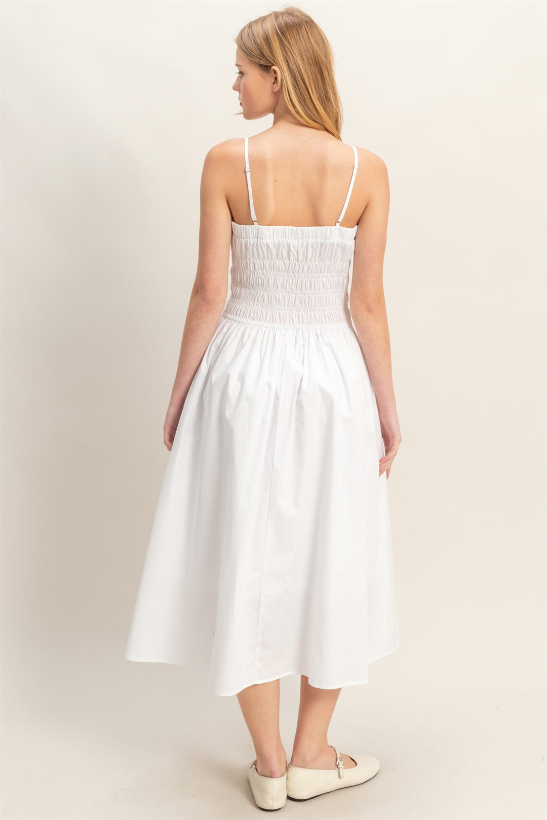 White Smocked Strapped Midi Dress with thin straps and smocked bodice. Available in sizes XS-XL.