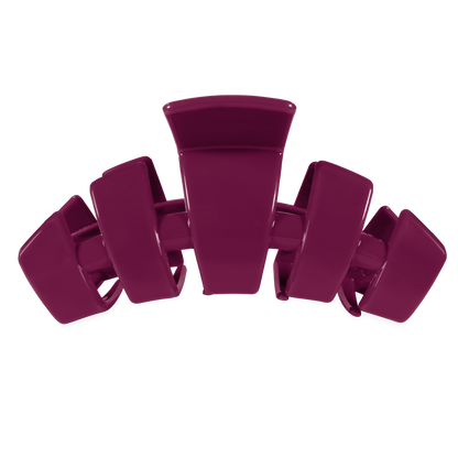 The Classic Mulberry Large Claw Clip by TELETIES is a durable, unbreakable hair clip in dark purple with wide rectangular prongs. Available in large size.