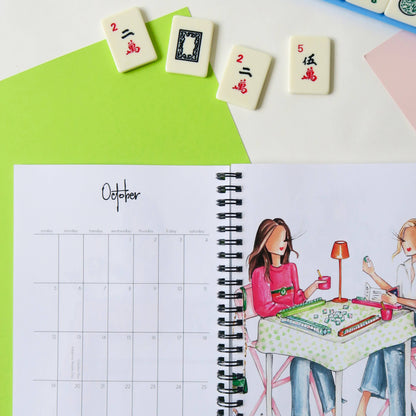 Spiral-bound 2025 Planner opened to October. Available sizes: small, medium, large.
