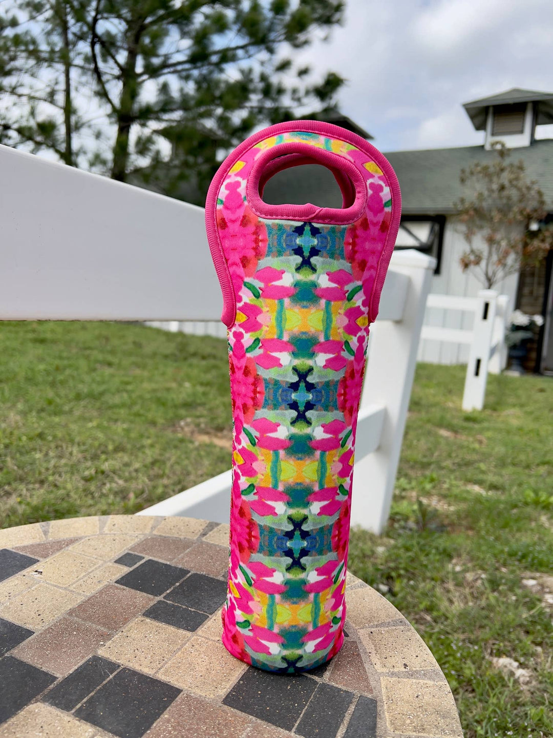 Laura Park Pink Paradise Wine Sleeve with colorful pattern and pink handle. Available in standard 750ml and magnum sizes.