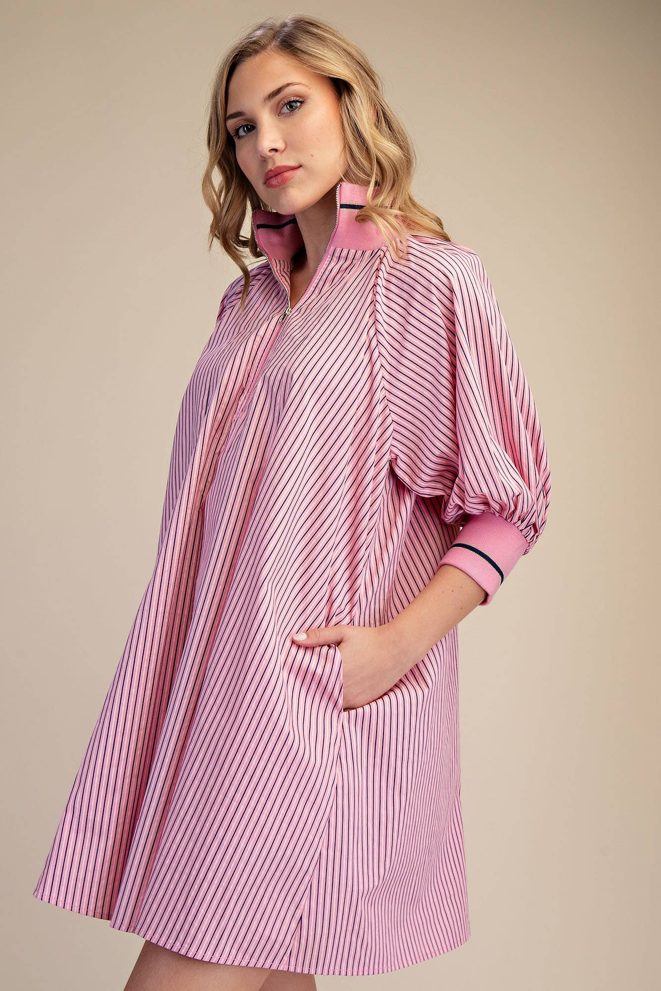 Pink Mock Neck Band Puff Sleeve Dress with pink and white stripes, three-quarter sleeves, and pockets. Available in sizes XS-XL.