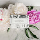 The "Vintage Peony Soap - Bath Bar" is a luxurious shea butter soap. It delivers a fresh, floral scent derived from pink peony flowers. The enriched formula provides gentle and nourishing cleaning. Available in one standard size.