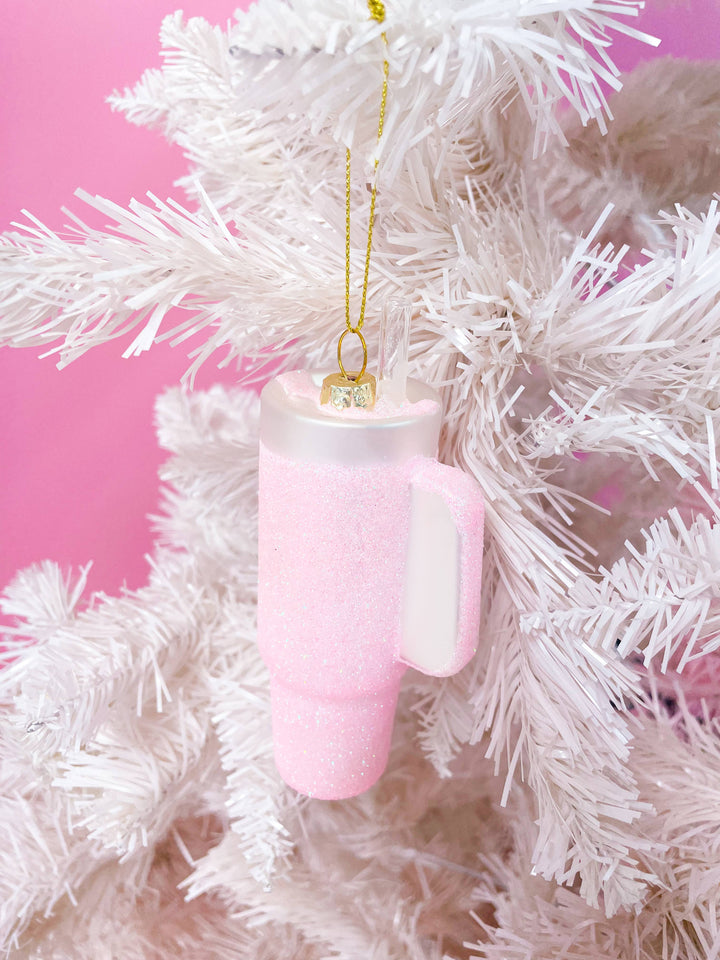 Pink glittered tumbler Christmas ornament with clear straw.