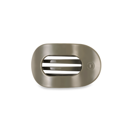 Metallic rectangular hair clip with horizontal slats and circular dial. Available in assorted sizes.