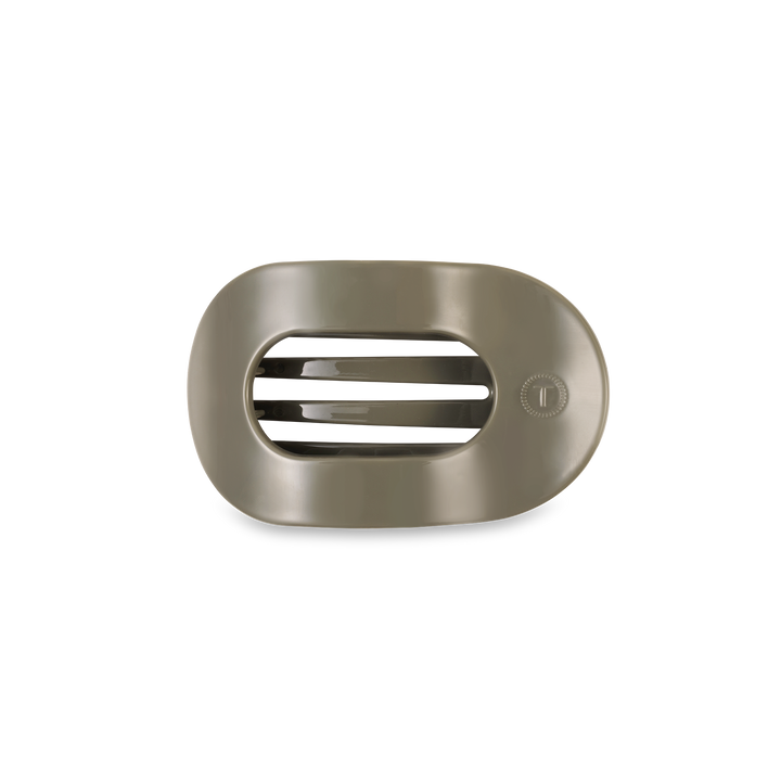 Metallic rectangular hair clip with horizontal slats and circular dial. Available in assorted sizes.