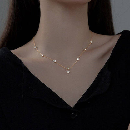 Four Petal Flower Friendship Necklace in 925 Sterling Silver with cubic zirconia petals. Available in 16", 18", and 20" lengths.