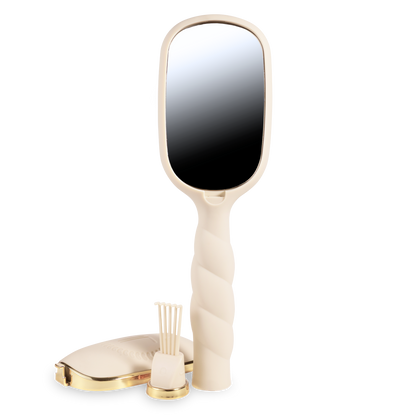 Cream and gold hand mirror with a twisted handle; available in small and medium sizes.