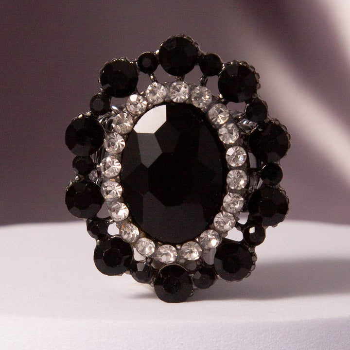 Oval Crystal Sunburst Double Halo Stretch Ring with black oval crystal, clear and black rhinestones. Available in stretch size.