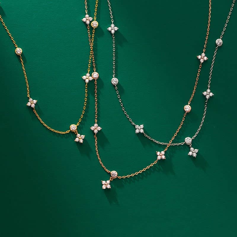 The Four Petal Flower Friendship Necklace in 925 Sterling Silver with cubic zirconia, available in gold or silver, sizes 16-20".