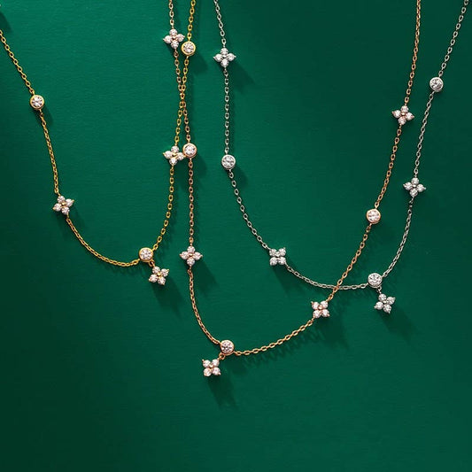 The Four Petal Flower Friendship Necklace in 925 Sterling Silver with cubic zirconia, available in gold or silver, sizes 16-20".