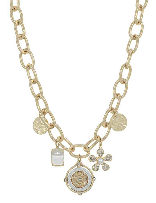 Gold necklace with flower charm, pearl accents, rhinestone coin, textured disc, and white stone. Sizes available: S, M, L.