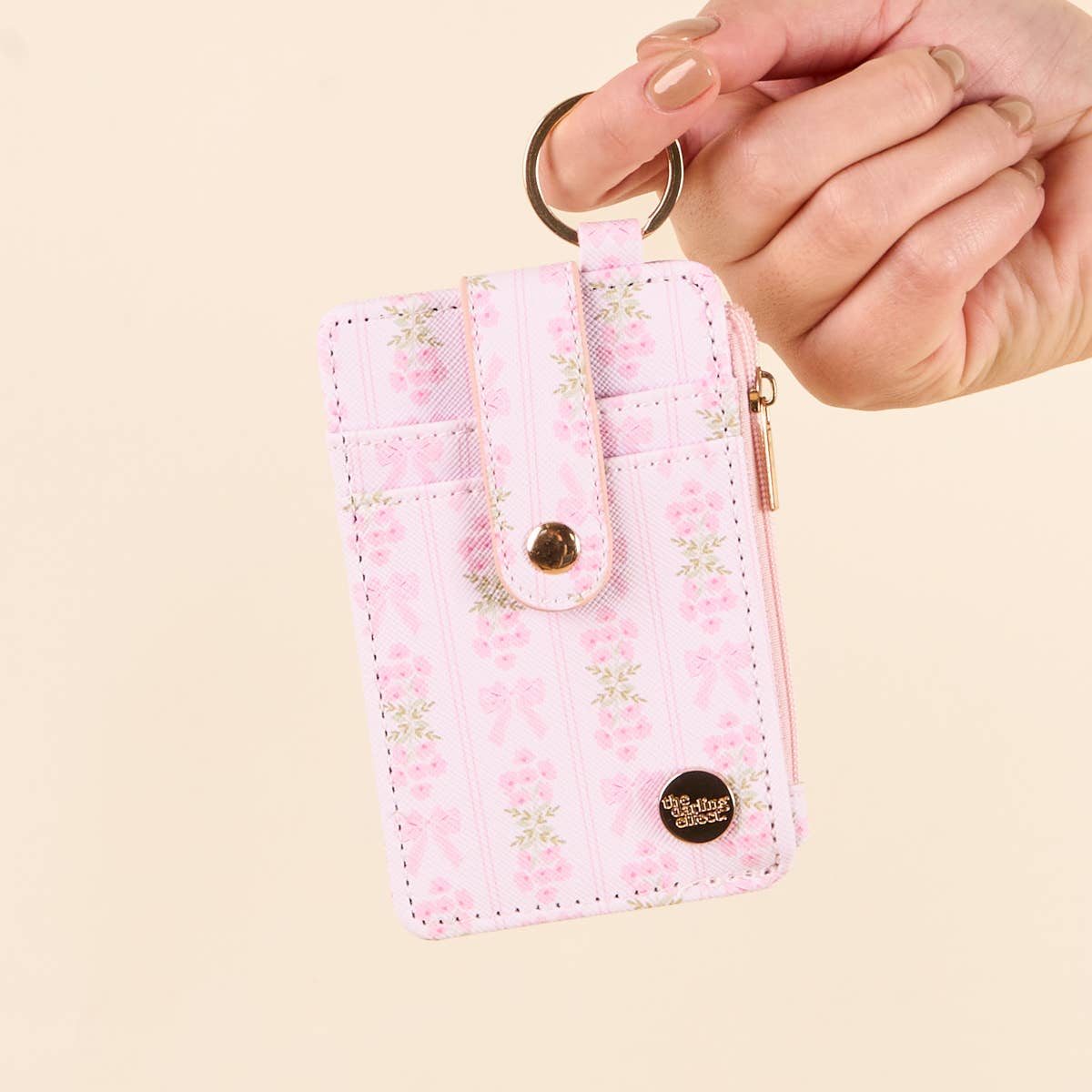 Keychain Wallet–Oh So Fancy Pink: floral pattern, zippered coin holder, buttoned strap, zipper pocket. Sizes: S, M, L.
