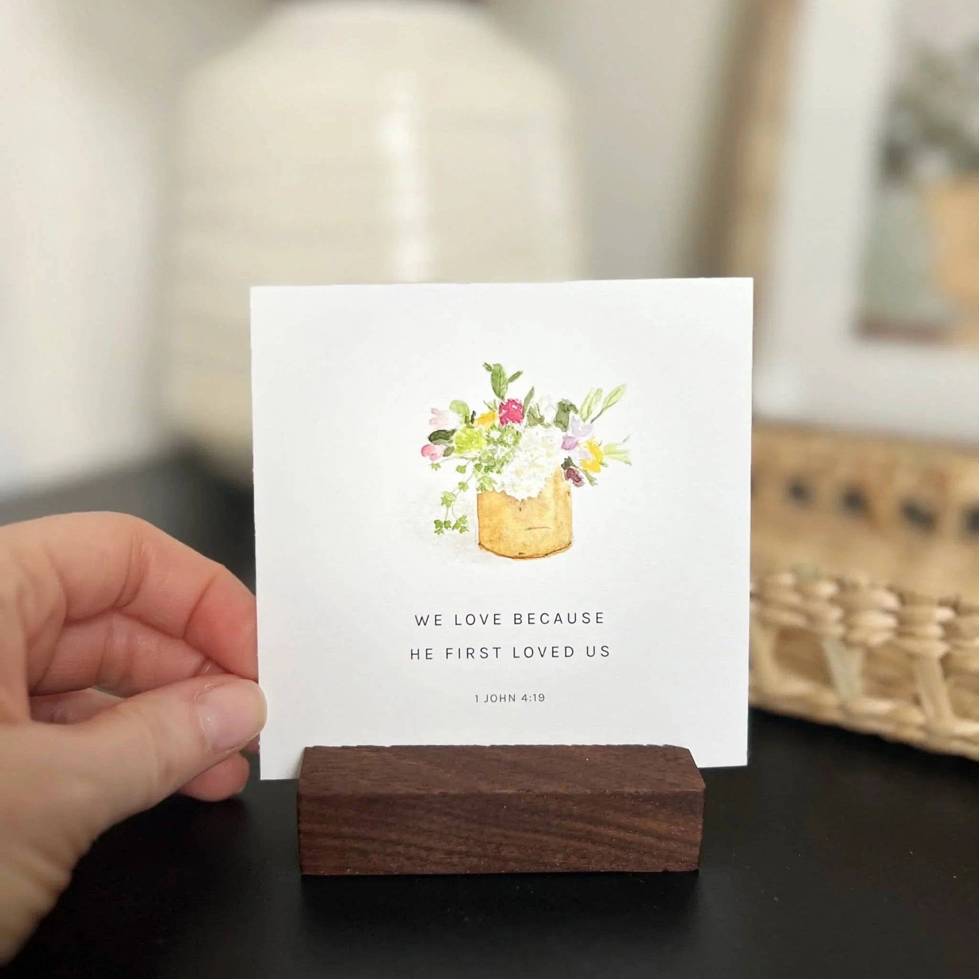 Truth for Today" card with watercolor bouquet and 1 John 4:19 verse. Available in 3x5 and 4x6 inches. Wood holder not included.