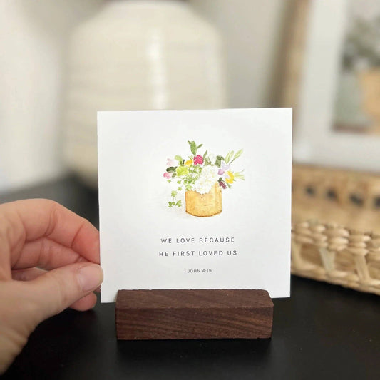 Truth for Today" card with watercolor bouquet and 1 John 4:19 verse. Available in 3x5 and 4x6 inches. Wood holder not included.