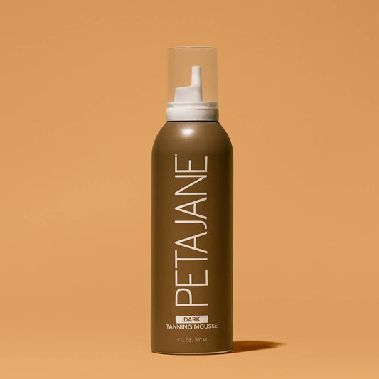 Bronze bottle of Dark Self-Tanning Mousse with clear cap, minimalist bold white label. Available in 200ml and 400ml sizes.
