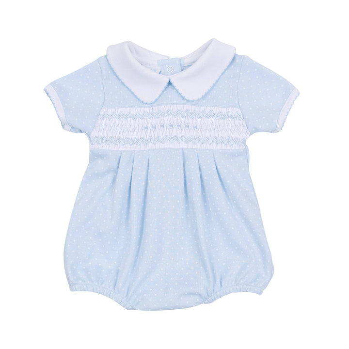 Light blue bubble with white polka dots, Peter Pan collar, smocking, elastic legs, snaps. Sizes: NB-24M.