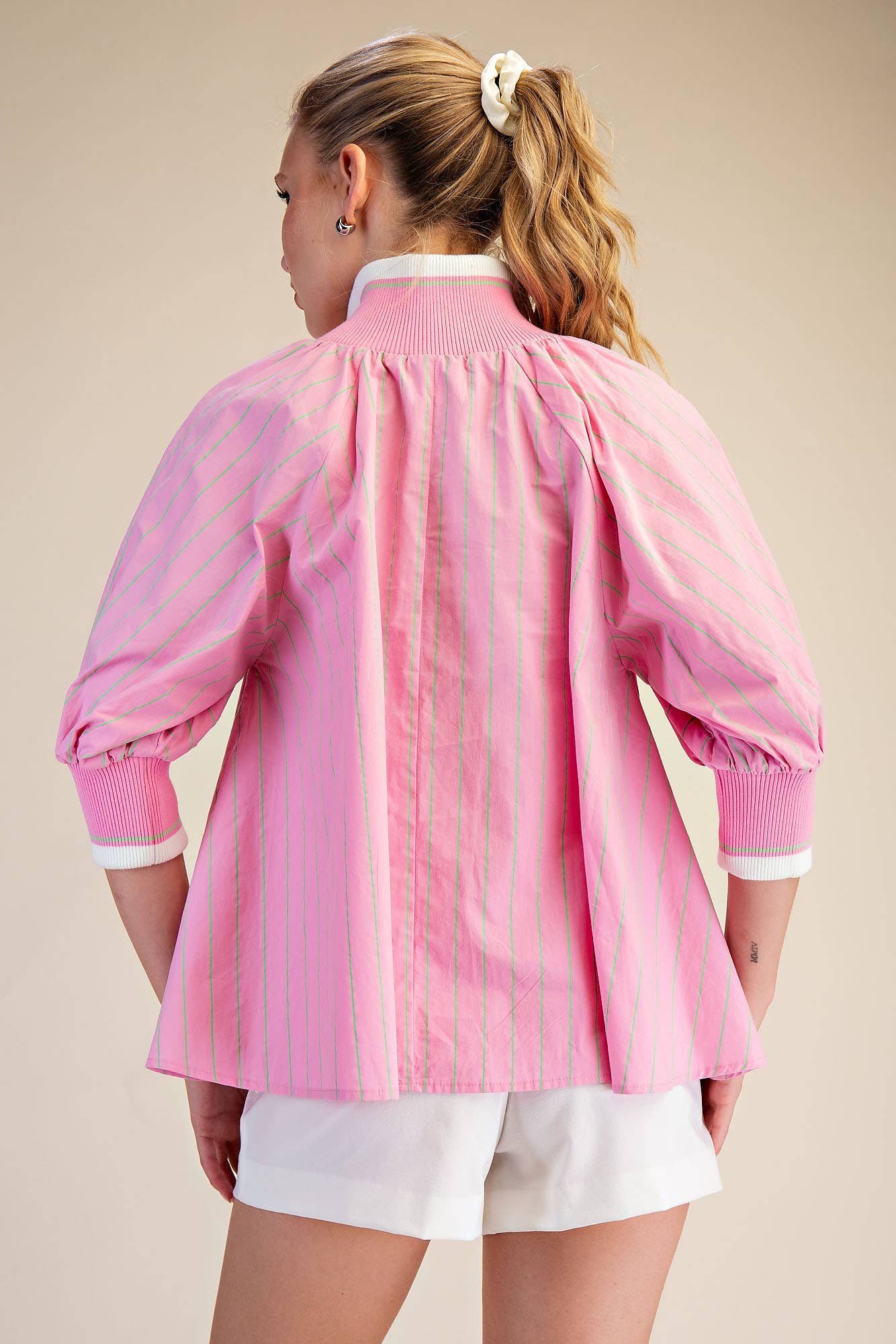 Pink Mock Neck Band Puff Sleeve Blouse shown from back. Available in sizes XS–XL.