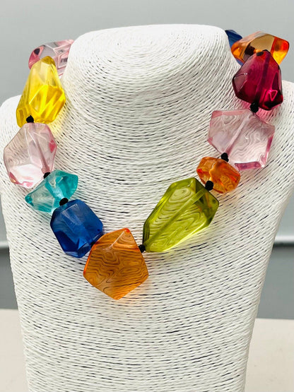 The CHIC - Clear Stone Necklace (multi) NK890 features large, faceted, irregular acrylic beads in bright yellow, pink, blue, green, orange, and red. Available sizes: one size fits most.