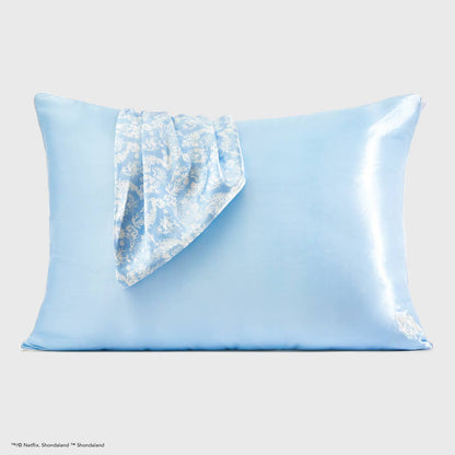 Light blue satin pillowcase with one corner in shiny, patterned blue and white. Available sizes: standard, king.