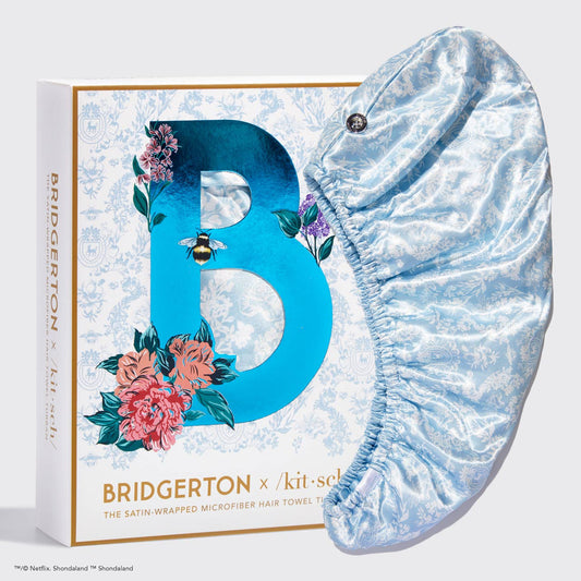 Light blue patterned microfiber hair towel with satin wrap, boxed with floral "B." Sizes: standard and extra large.