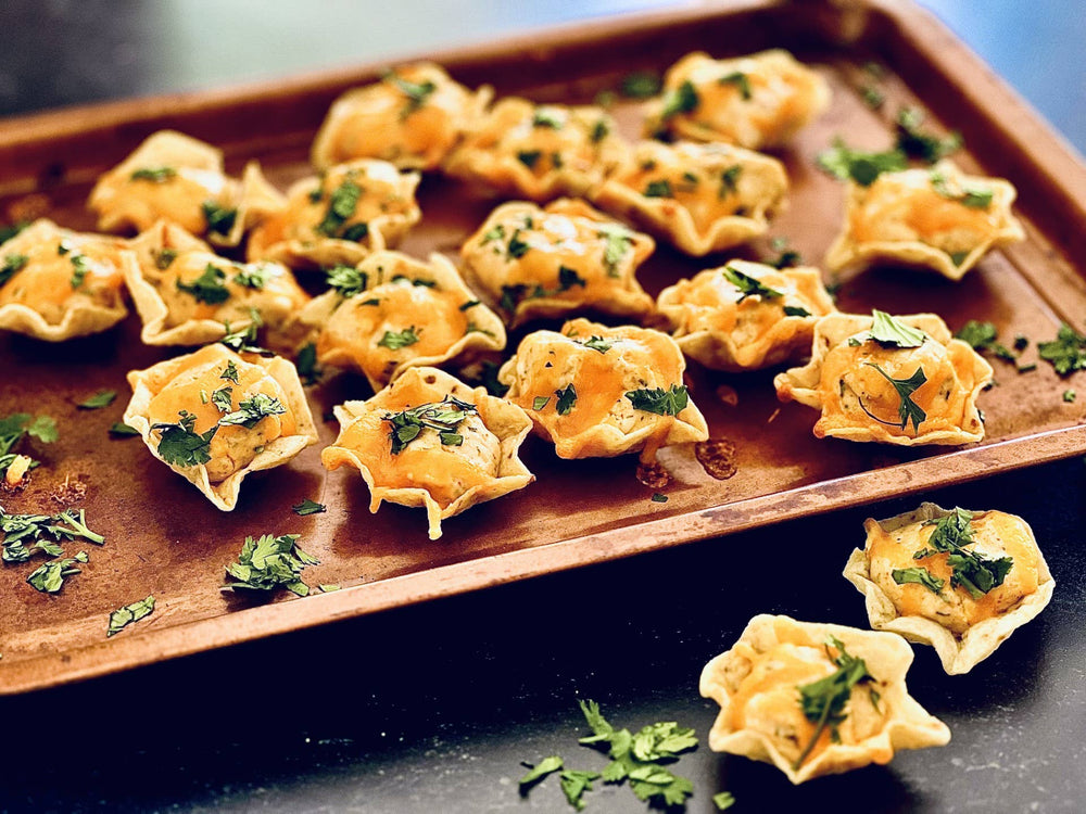 Mini phyllo pastry cups with Baked Enchilada Dip Mix, topped with fresh herbs. Available in mini size.
