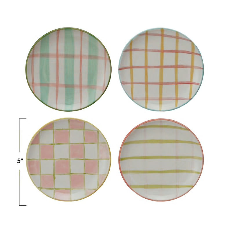 Set of four 5" round handpainted stoneware plates, each with a unique pastel plaid or checkered design in green, blue, pink, yellow.