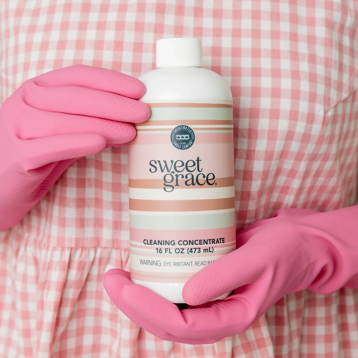 Sweet Grace Cleaning Concentrate bottle with a white and pink label featuring silver accents. Available in 16 oz and 32 oz sizes.