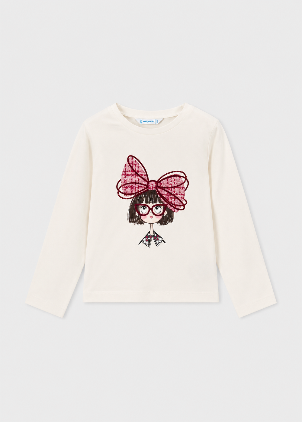 White long sleeve t-shirt with front graphic of cartoon girl, red glasses, and a big red bow. Available in multiple sizes.