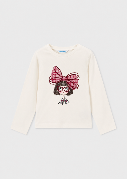 White long sleeve t-shirt with front graphic of cartoon girl, red glasses, and a big red bow. Available in multiple sizes.