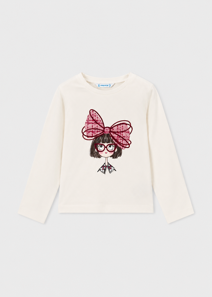 White long sleeve t-shirt with front graphic of cartoon girl, red glasses, and a big red bow. Available in multiple sizes.