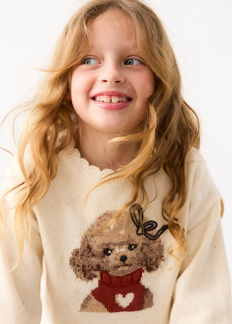 Cream intarsia knit sweater featuring a cartoon poodle with a bow and a red scarf with a white heart. Available in sizes 2T, 3T, 4T, and 5.