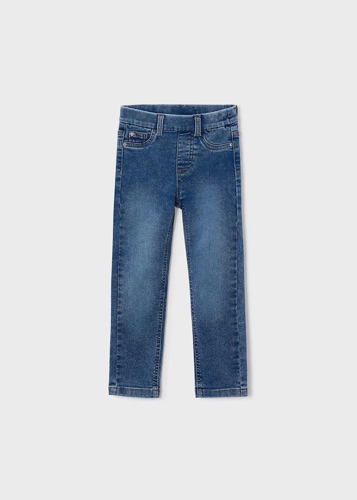 Little Girl Denim Skinny Fit Jeans in light blue with front pockets, belt loops, pull-on style, and adjustable waistband. Available in kids’ sizes.