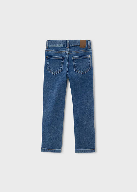 Light blue skinny fit jeans with two back pockets and a brown leather patch on the waistband; available in sizes 2T–6X.