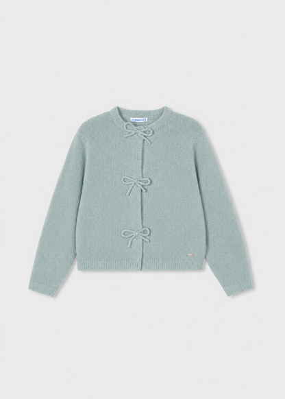 Light blue long-sleeve cardigan with three front bow closures, crew neckline, and small metallic logo tag near the hem. Available in sizes 2T-6X.