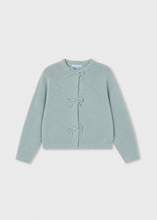 Light blue long-sleeve cardigan with three front bow closures, crew neckline, and small metallic logo tag near the hem. Available in sizes 2T-6X.
