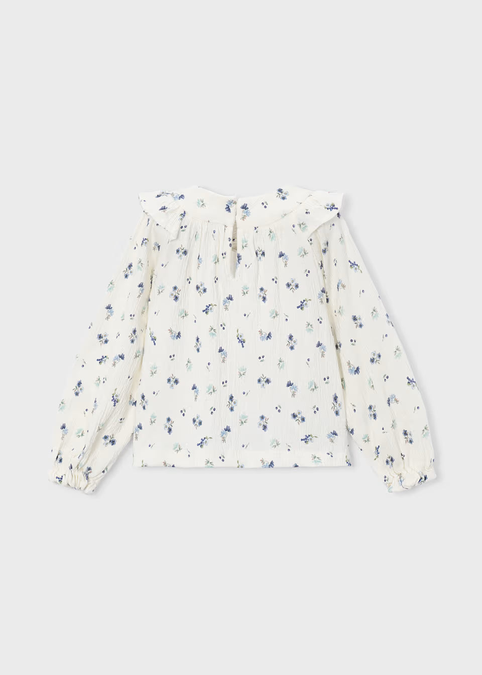 White long-sleeve crinkle cotton blouse with blue and green floral print, ruffled collar, pleated detailing, and elastic cuffs. Available in girls’ sizes 2T–6X.