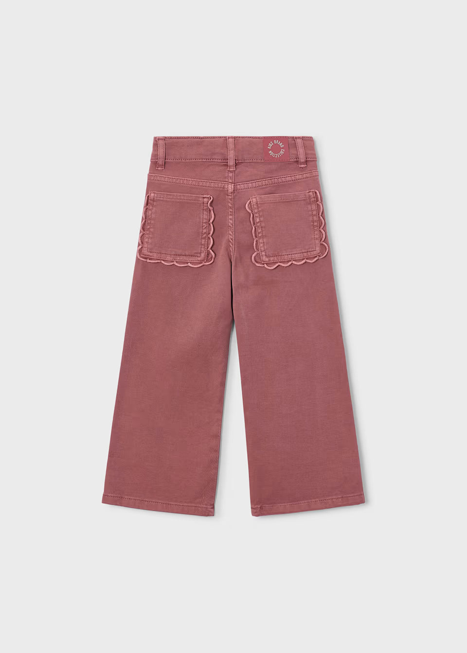 Pink twill scallop pants with wide-leg fit, comfortable stretch, and scalloped back pocket edges. Available in sizes 2T-6.