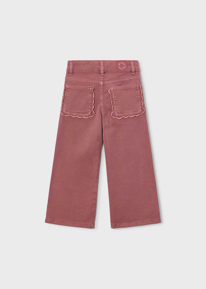Pink twill scallop pants with wide-leg fit, comfortable stretch, and scalloped back pocket edges. Available in sizes 2T-6.