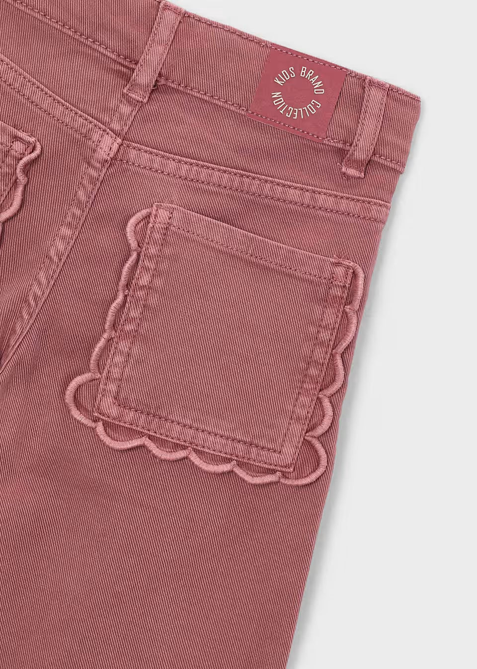 Pink Little Girl Twill Scallop Pants with a scalloped back pocket and “Kids Brand Collective” waistband label. Available in sizes 2T-6.