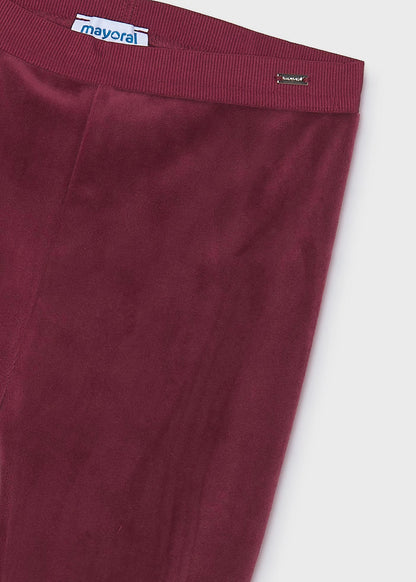 Maroon Little Girl Velvet Leggings with a stretchy elastic waistband and small metallic “Mayoral” brand tag. Ultra-soft velvet fabric. Available in sizes 2-9 years.