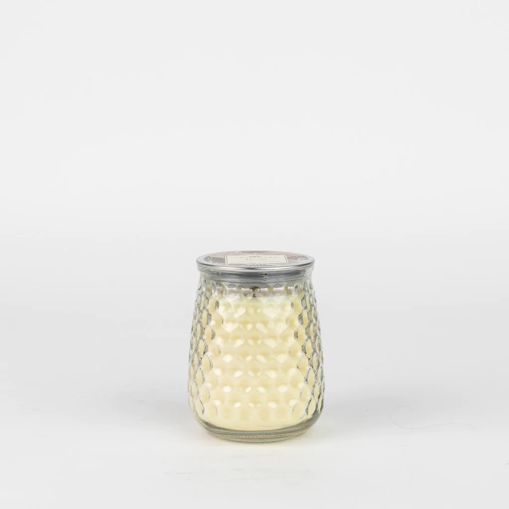 The Haven Signature Candle GLG915489 has creamy white wax in a small textured glass jar with metal lid. Size: small.