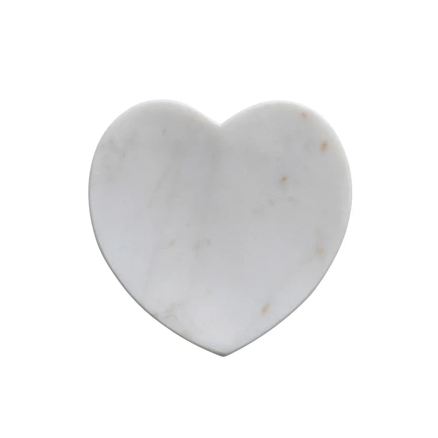 White marble heart-shaped dish with grey veins and small brown spots; available in multiple sizes.