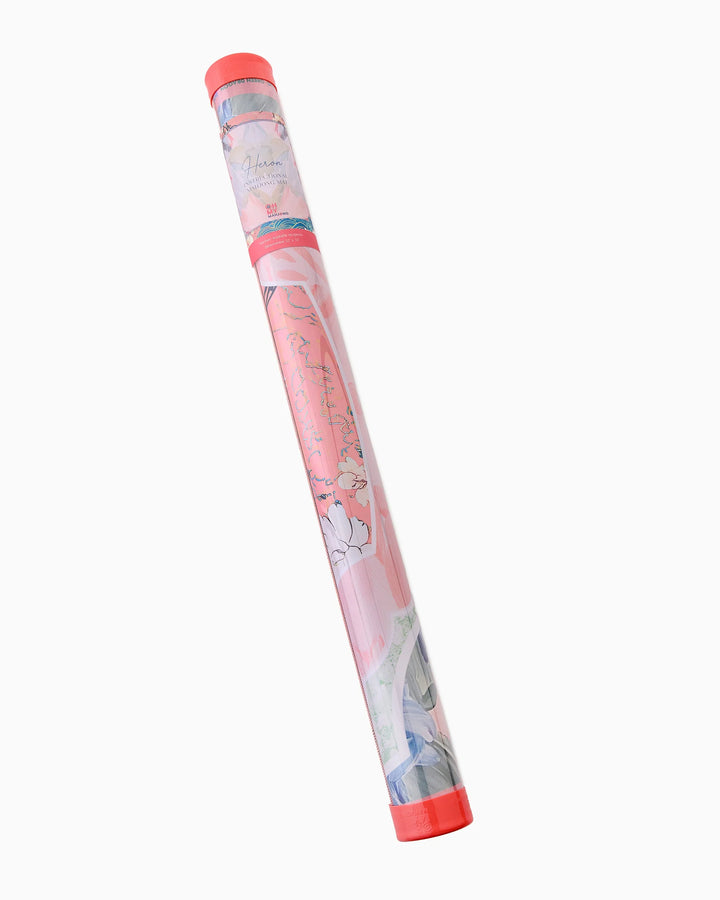 Cylindrical tube with red cap holds rolled mahjong mat with floral and abstract designs. Available in multiple sizes.