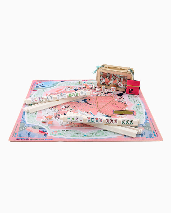 The Heron Mat in Tube: pastel mahjong set, pink neoprene mat, tile racks, dice, case, pouch. Sizes available.